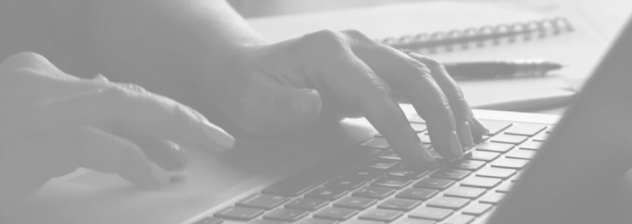hands typing on keyboard